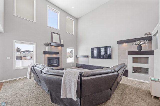 living room with a wealth of natural light and a high ceiling