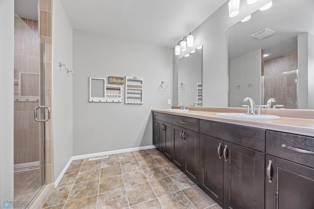 bathroom featuring vanity and a shower with door