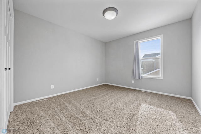 unfurnished room featuring carpet flooring