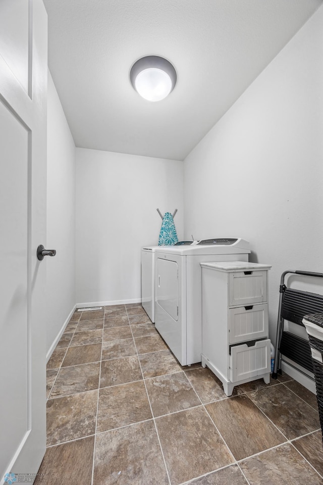 laundry room featuring independent washer and dryer