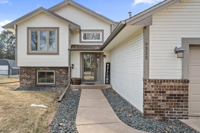 doorway to property with a garage