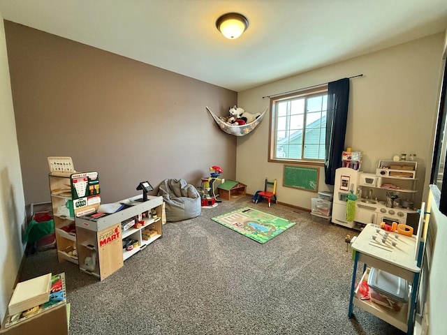 game room with dark colored carpet