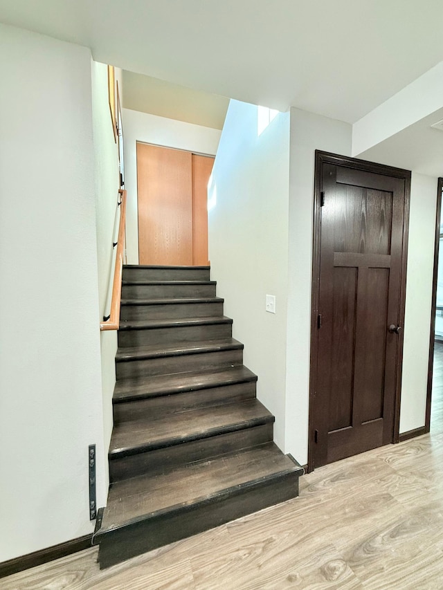 stairway with wood-type flooring