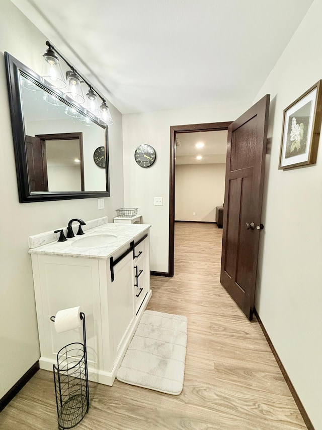 bathroom featuring vanity and hardwood / wood-style floors