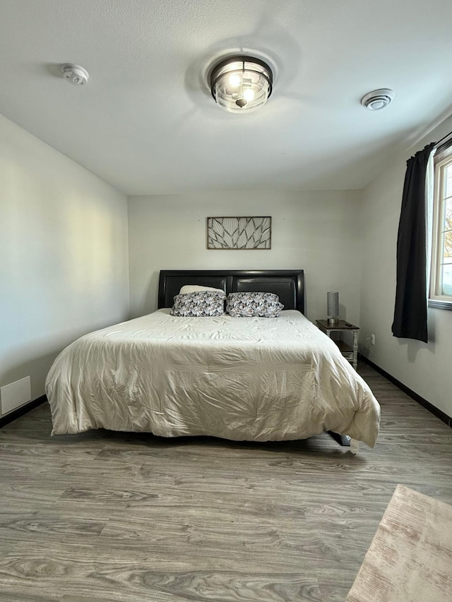 bedroom featuring hardwood / wood-style floors