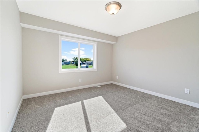 unfurnished room with carpet floors