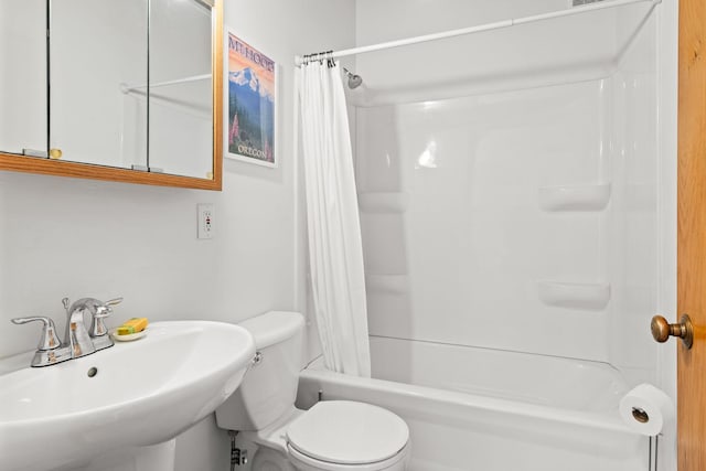 full bathroom featuring shower / bath combo, sink, and toilet