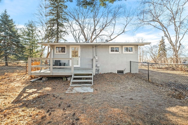 rear view of house featuring a deck