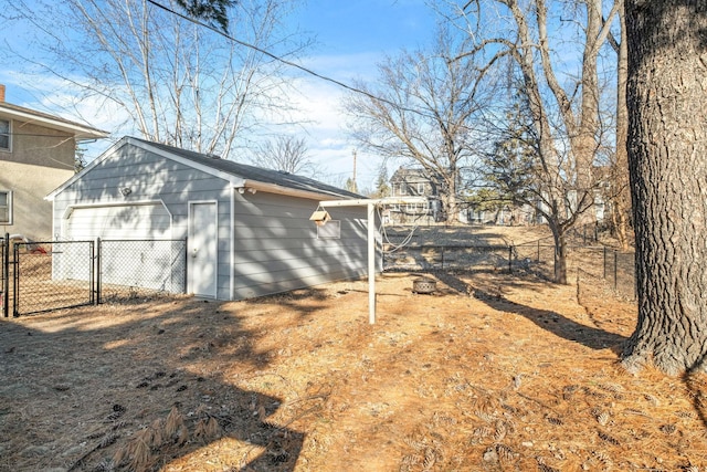 view of home's exterior featuring a garage and an outdoor structure