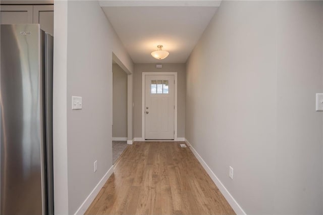 doorway to outside featuring light hardwood / wood-style flooring