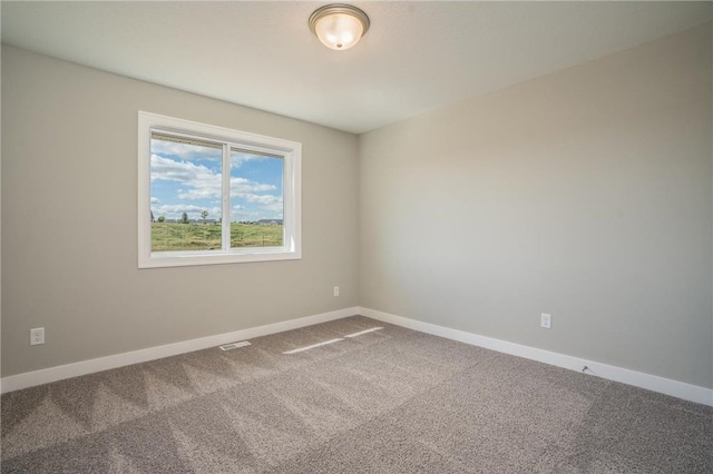 empty room with carpet flooring