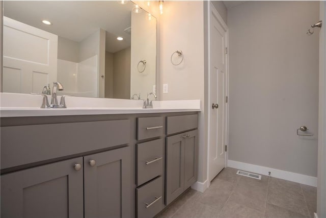 bathroom with vanity and tile patterned floors