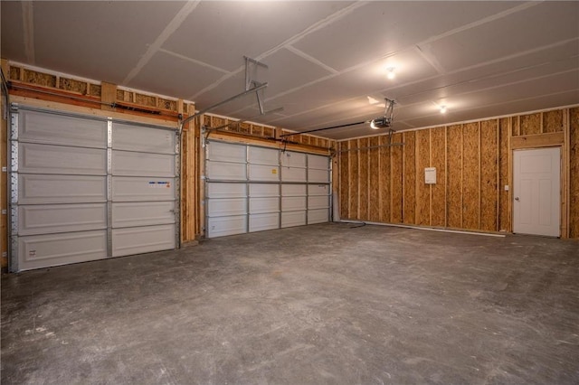 garage featuring wooden walls