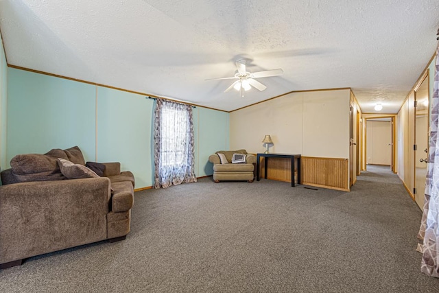 carpeted living room featuring lofted ceiling, ceiling fan, and a textured ceiling