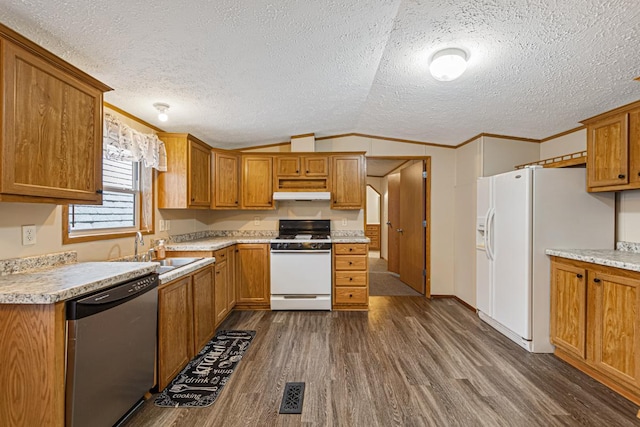 kitchen with sink, crown molding, vaulted ceiling, dark hardwood / wood-style flooring, and white appliances