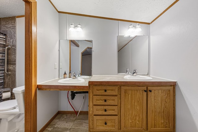 bathroom featuring crown molding, sink, a textured ceiling, and toilet