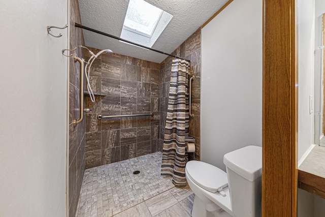 bathroom featuring walk in shower, toilet, a skylight, a textured ceiling, and tile patterned flooring