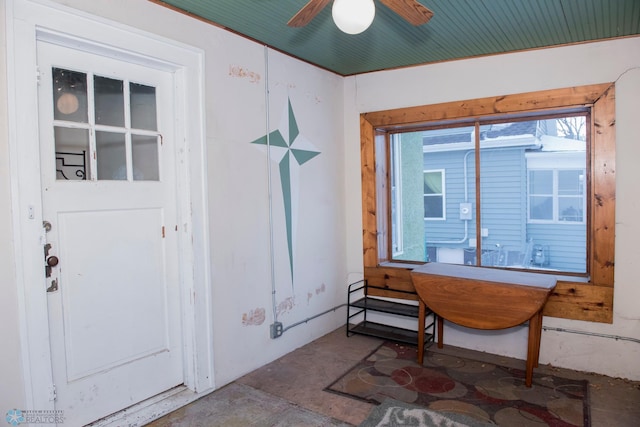 interior space with ceiling fan