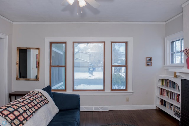 bedroom featuring ornamental molding, dark hardwood / wood-style flooring, and ceiling fan