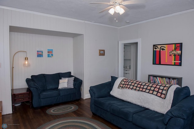 living room with crown molding, ceiling fan, dark hardwood / wood-style flooring, and a textured ceiling