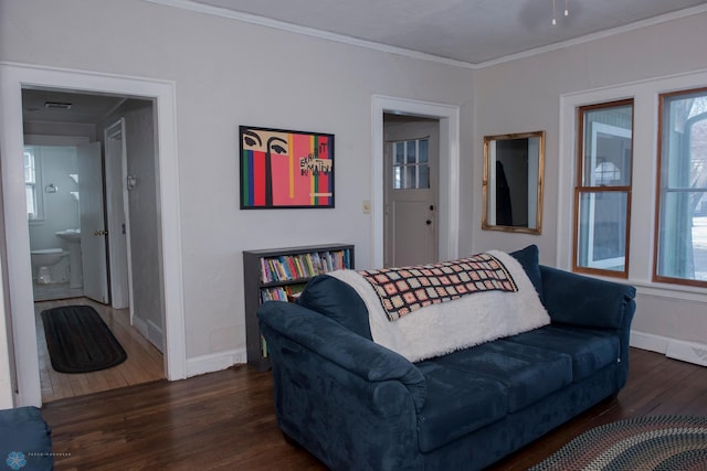 living room featuring ornamental molding and dark hardwood / wood-style flooring