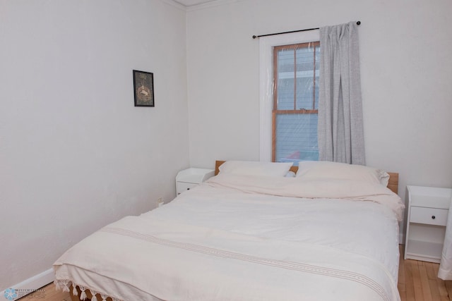 bedroom with light wood-type flooring