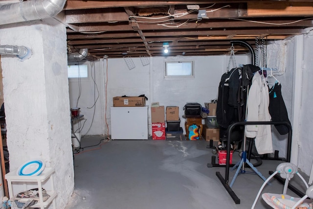 basement featuring washer / clothes dryer and a wealth of natural light