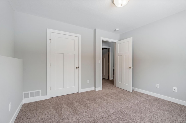 unfurnished bedroom with carpet flooring