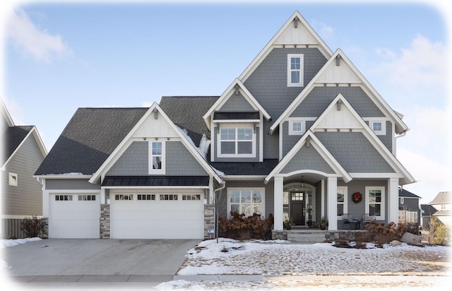 craftsman-style home with a porch and a garage