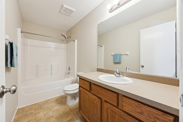 full bathroom featuring a textured ceiling, toilet, visible vents, vanity, and  shower combination