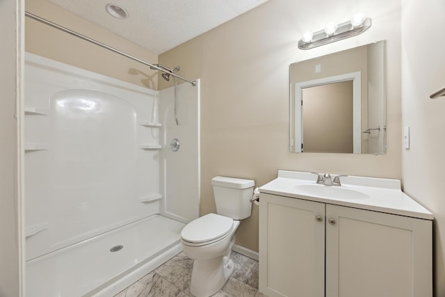 full bath featuring a textured ceiling, toilet, vanity, marble finish floor, and a shower