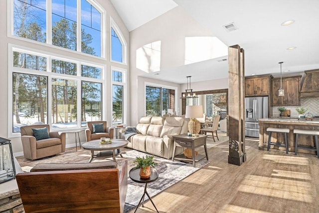 sunroom featuring a notable chandelier