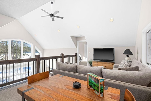 living room featuring high vaulted ceiling and ceiling fan