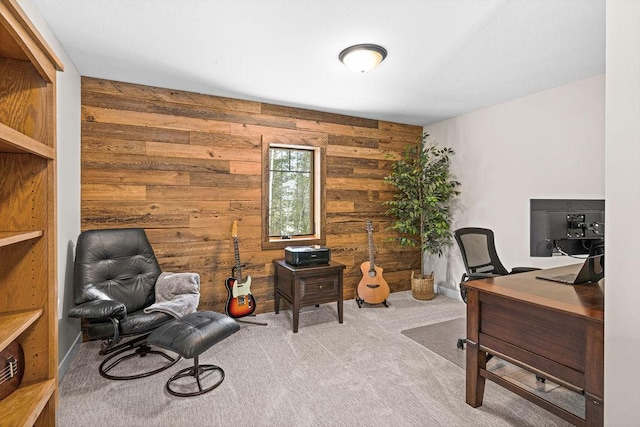 home office with light colored carpet and wood walls