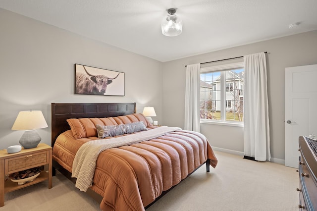 bedroom with light colored carpet