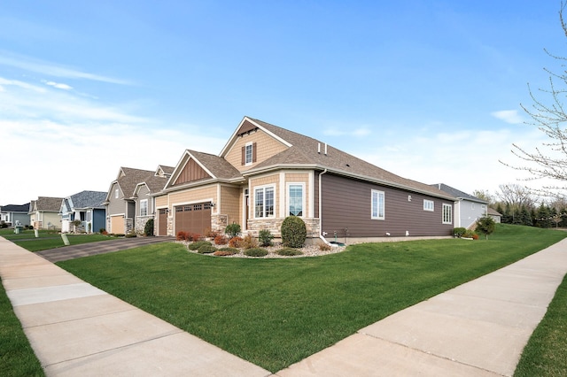 view of front of property with a garage and a front yard