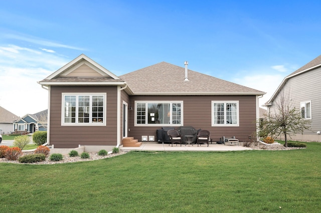 rear view of house featuring a lawn and a patio area