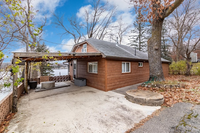 view of side of property with a patio area