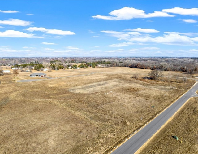 birds eye view of property featuring a rural view