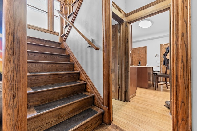 staircase with wood finished floors