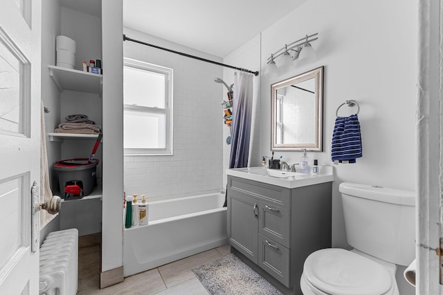 bathroom featuring tile patterned flooring, toilet, vanity, radiator, and shower / tub combo with curtain