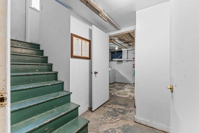 below grade area with washer / dryer and stairway