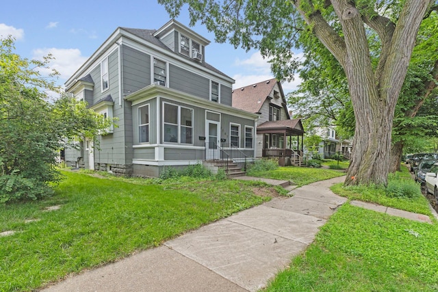 2707 Fremont Ave S, Minneapolis, MN 55408 - american foursquare style home with a front lawn and a shingled roof