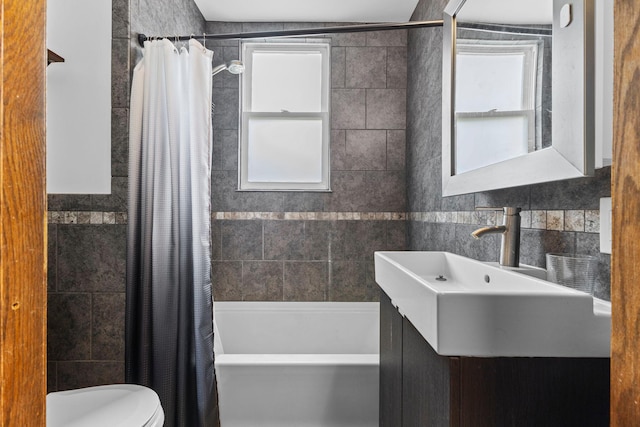 2707 Fremont Ave S, Minneapolis, MN 55408 - full bath with tile walls, shower / bath combo with shower curtain, and vanity