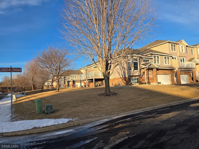 view of front facade featuring a garage and a front lawn