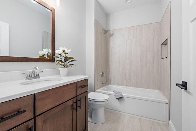 full bathroom with bathing tub / shower combination, vanity, and toilet