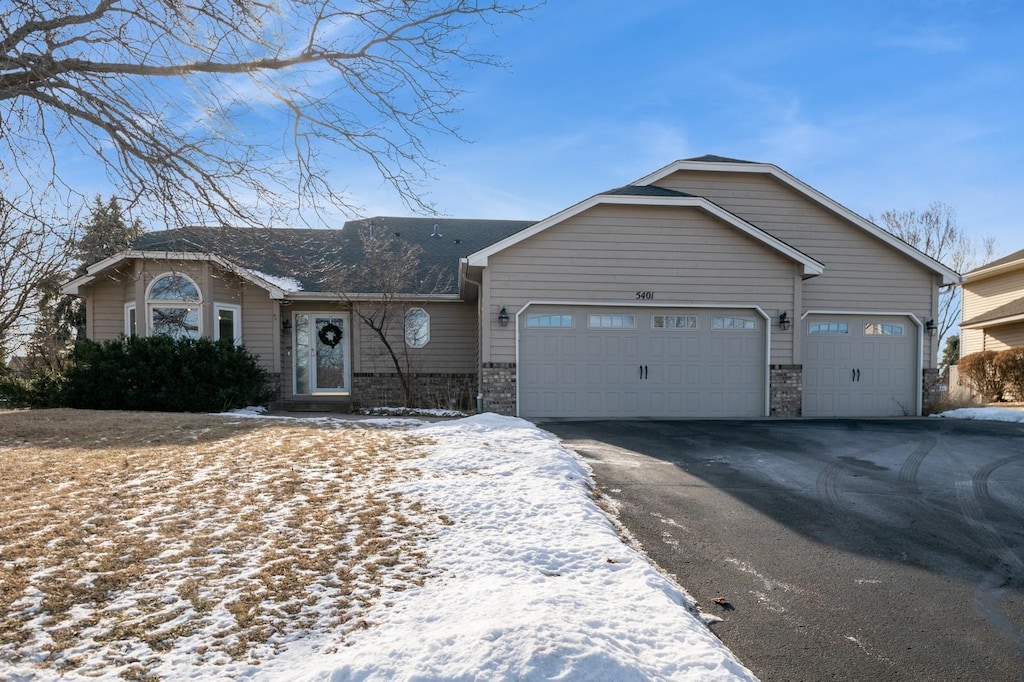 ranch-style home featuring a garage