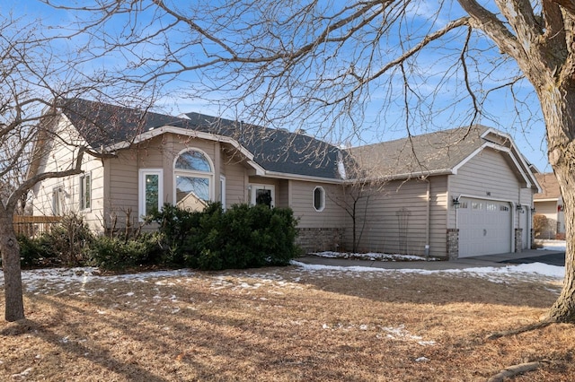 single story home with a garage