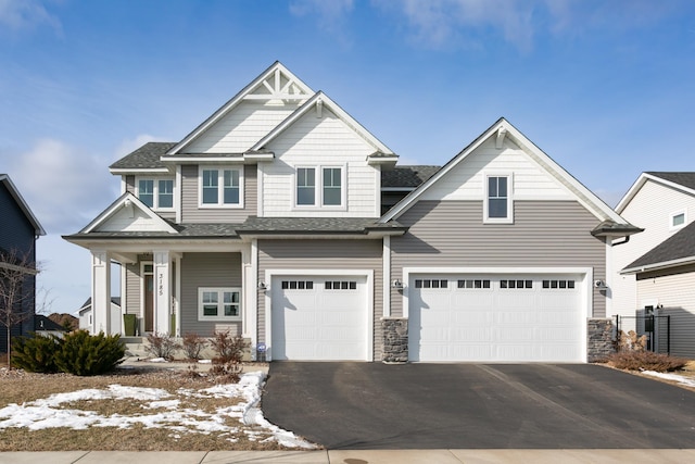 craftsman-style home featuring a garage and a porch