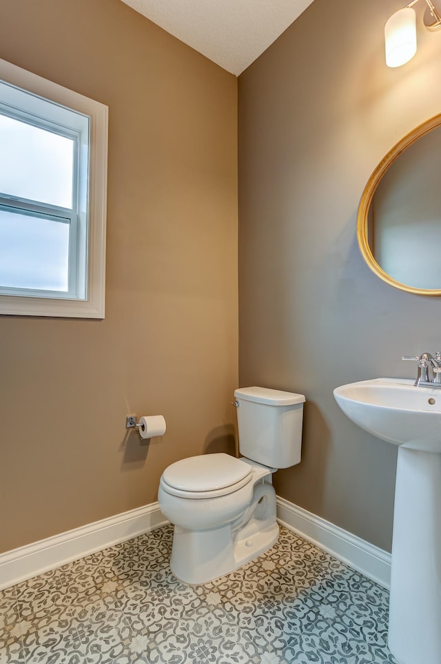 bathroom featuring sink and toilet